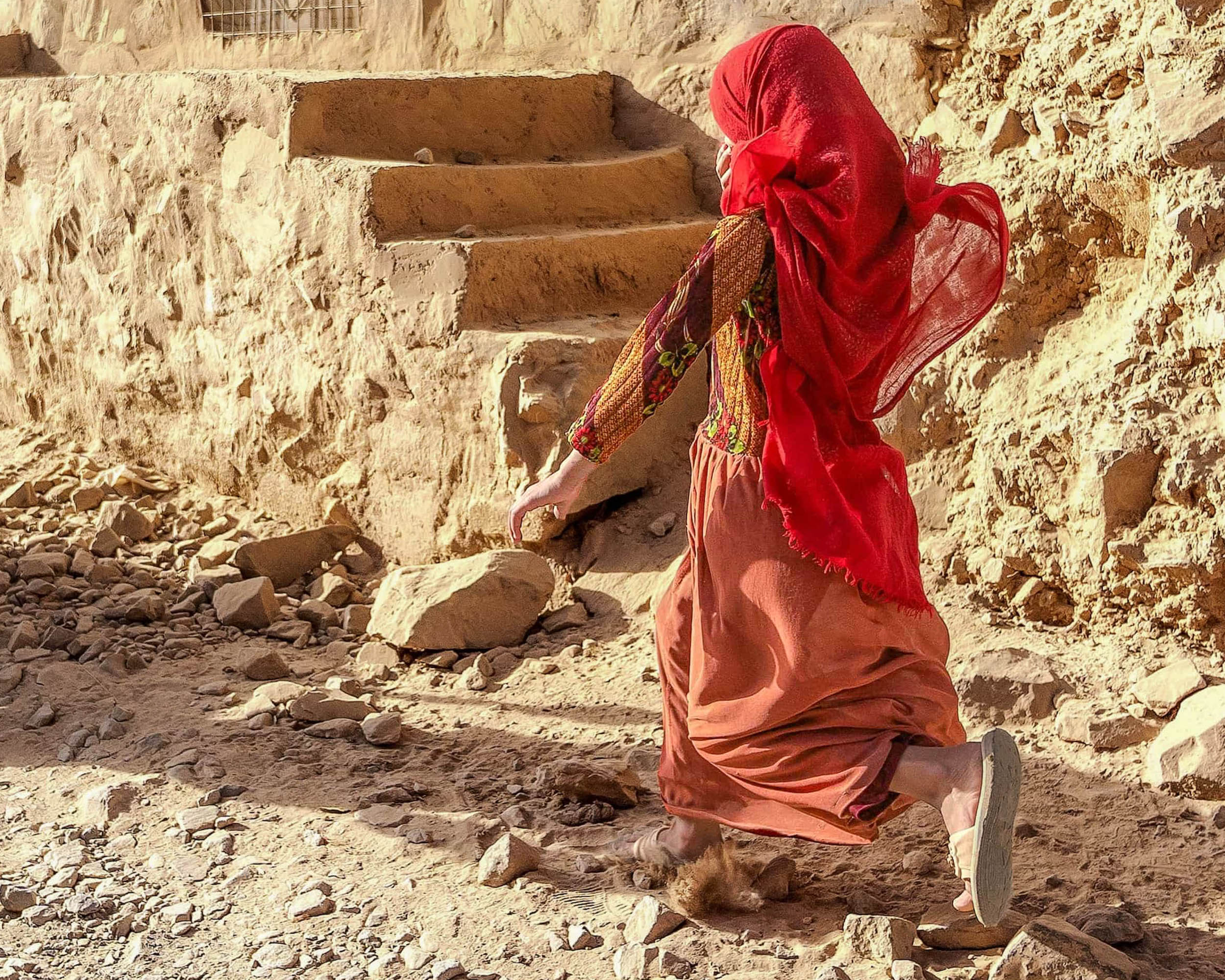 Running woman with red scarf